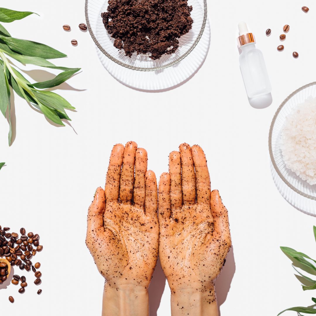 Two hands with exfoliator all over them, with palms facing up.
